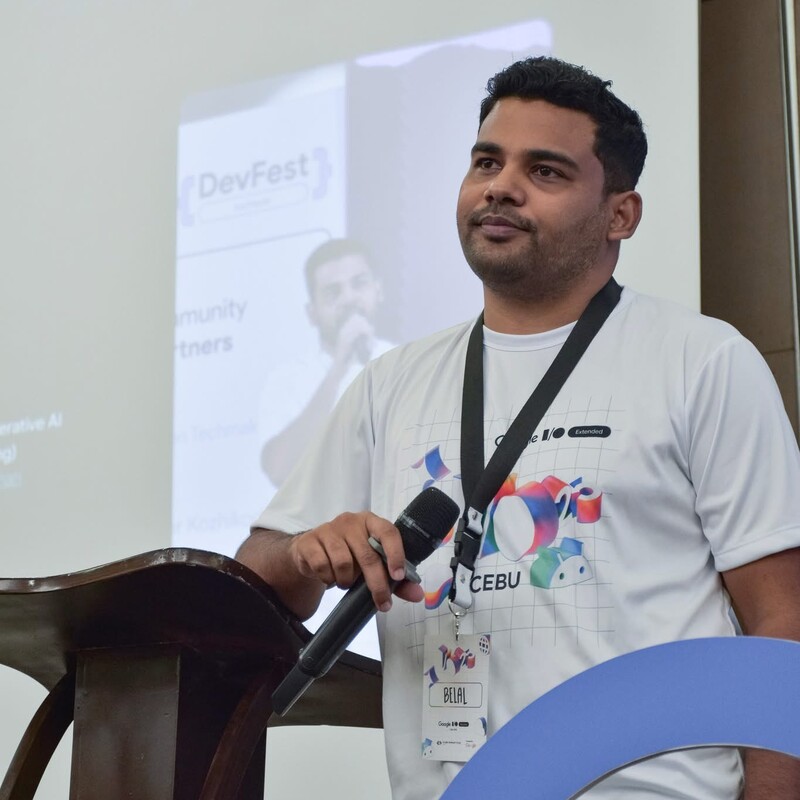 Belal Khan speaking at a developer event
